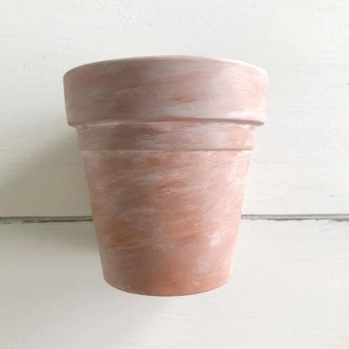 Aged terra cotta pot with paint and stain