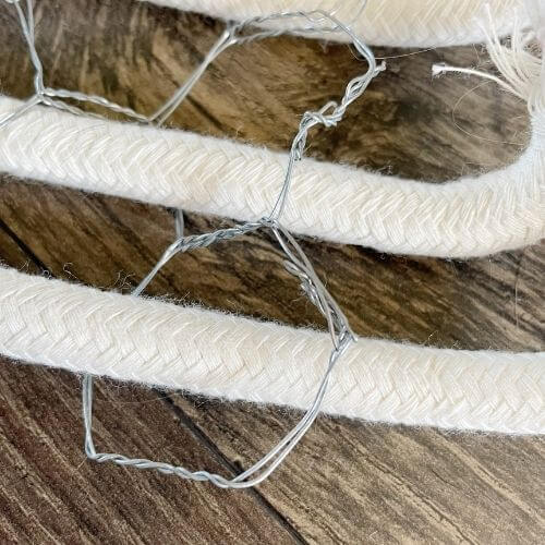 Push edges of wire together