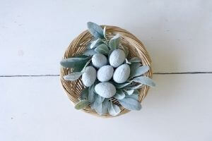 Faux concrete Easter eggs displayed in basket