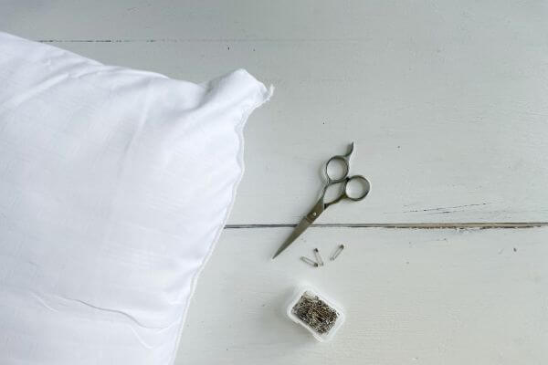 Pillow, scissors and safety pins