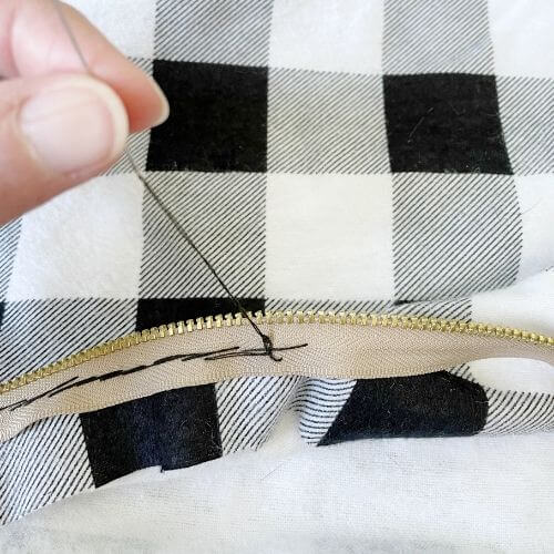 Pull needle through and make knot
