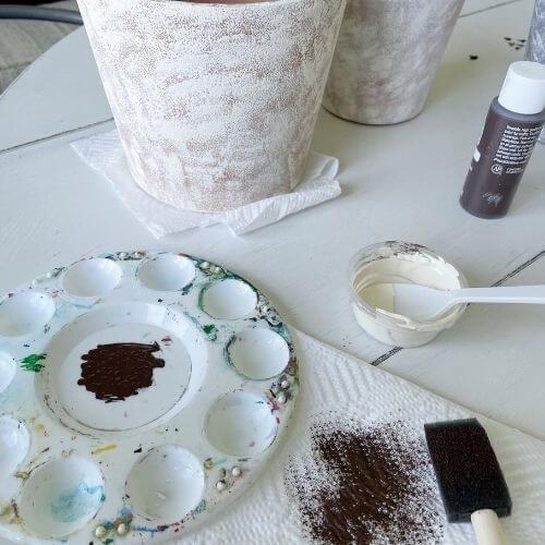 Apply brown paint to clay pot