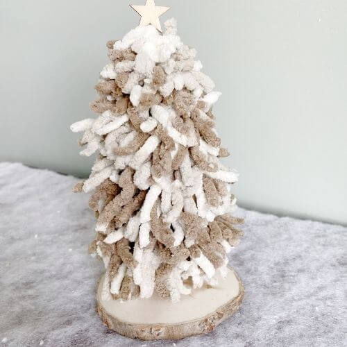 Finished yarn Christmas tree DIY with white and tan yarn