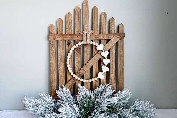 Wood bead Valentine wreath displayed on wall