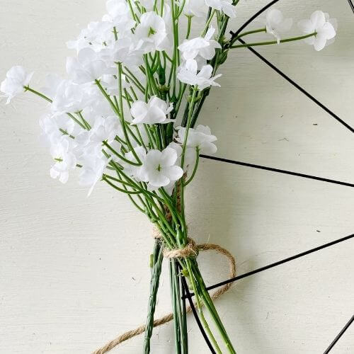 Secure third bunch of baby's breath floral using jute twine