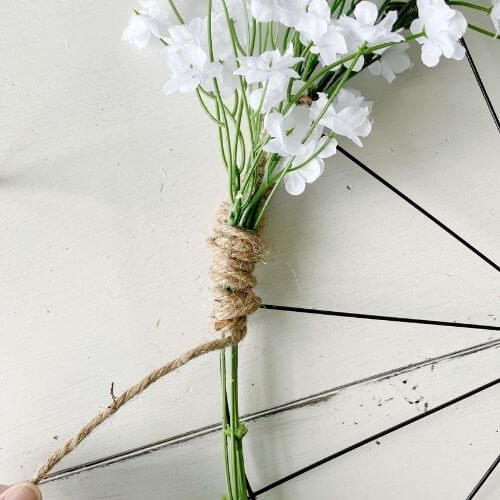 Continue wrapping your jute twine around the 3rd bunch stem