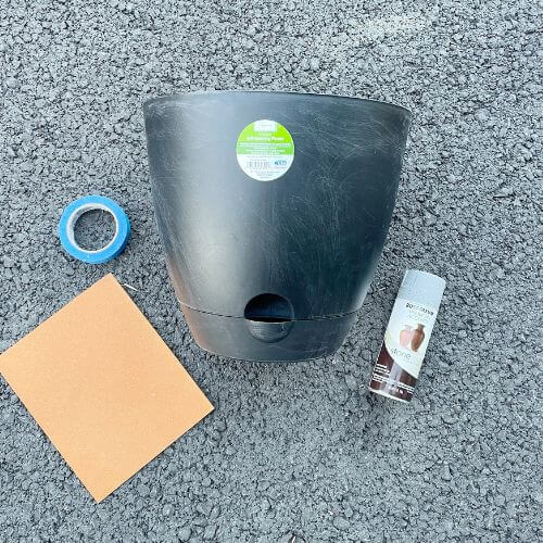 Supplies including pot, sandpaper, stone spray and tape