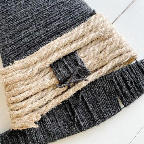 Wrap yarn through rope until buckle is created and tie in back