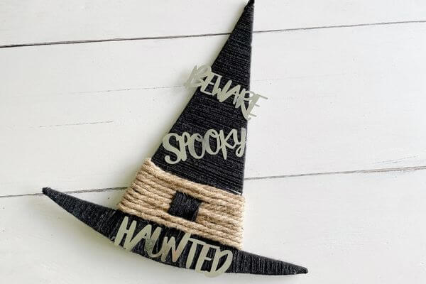 Dollar Tree Witch Hat Wreath using yarn, rope and metal words