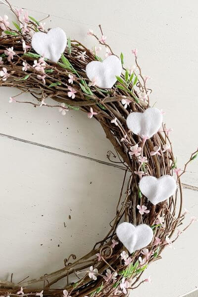Five hearts on grapevine wreath.