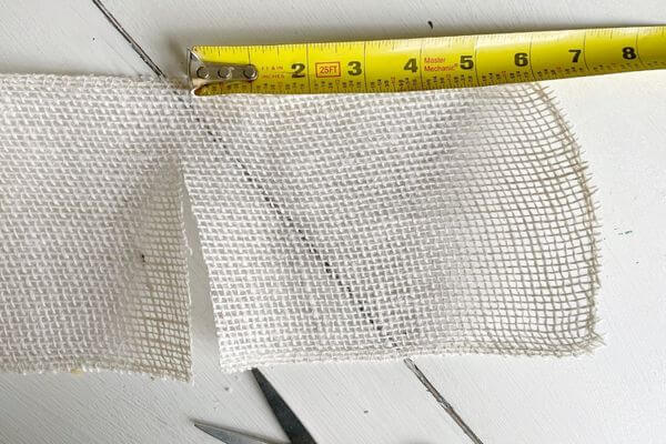 Measure and then cut 6-inch section of white burlap.