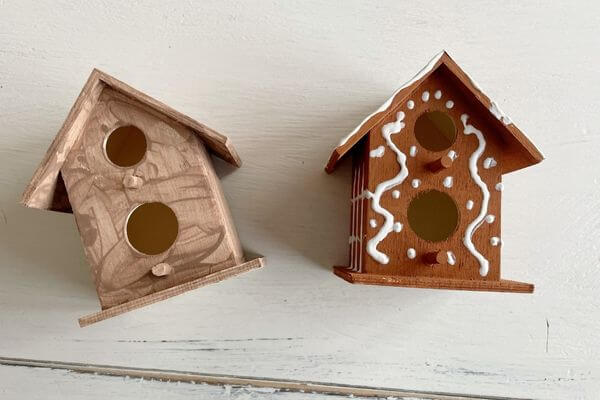 One coat of brown paint from Dollar Tree vs one coat of brown paint from Walmart on two birdhouses