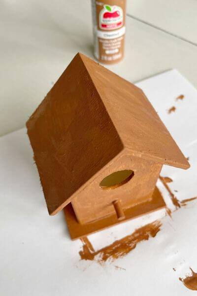Wooden birdhouse painted with Chestnut brown paint 