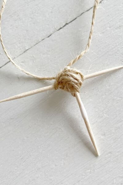 Wrap the jute twine around the hot glue ball and tie at the top.