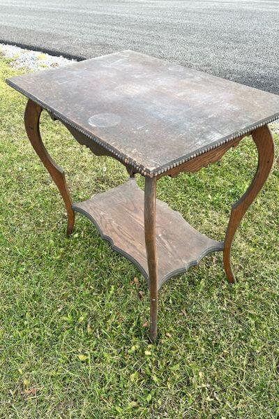 Small table in original dark stain before stripping