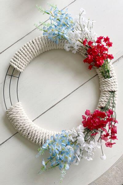 Patriotic wreath DIY almost completed with small gap of rope to be completed. 