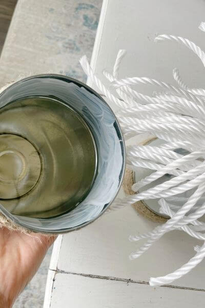 Place a thick line of mod podge all the way around the inside lip of the other galvanized vase.