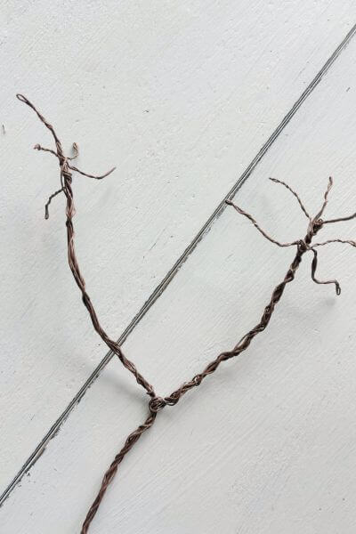 Smaller branches added to the end of the second limb by doubling the wire to form each branch.