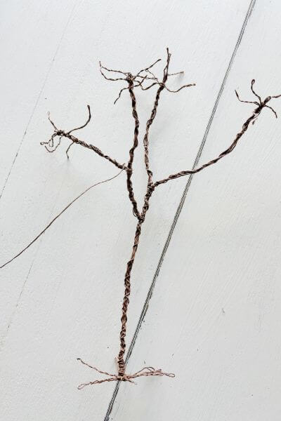 Picture of the Halloween wire tree with 4 limbs, and branches at each end. 
