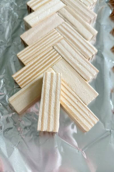 Place a Jenga block on the glue to make the tree trunk.