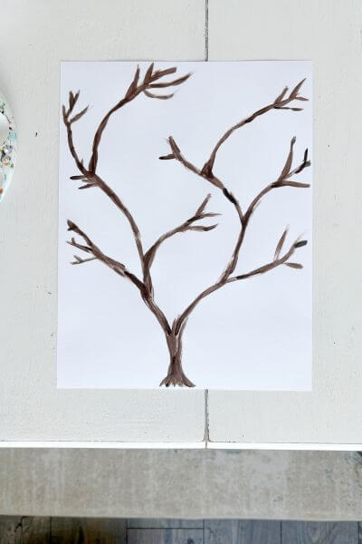 Brown tree with multiple branches painted on cardstock.