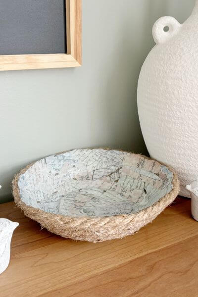 Jute rope bowl displayed with a white vase.