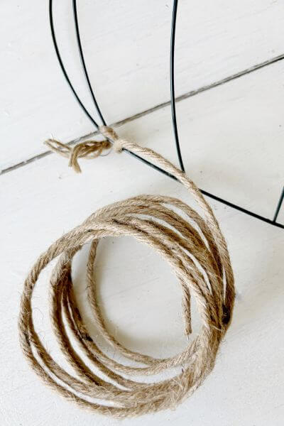 Wrap the jute wire around the bottom of the first inner section of the wire form to secure it.