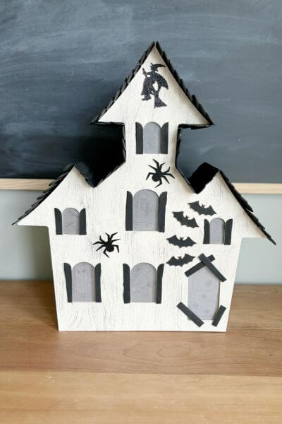 First side of miniature haunted house DIY using Dollar Tree supplies. 