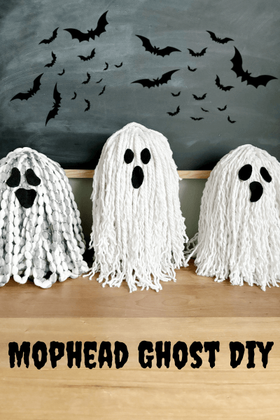 Three mop head ghosts with bats in the background. 