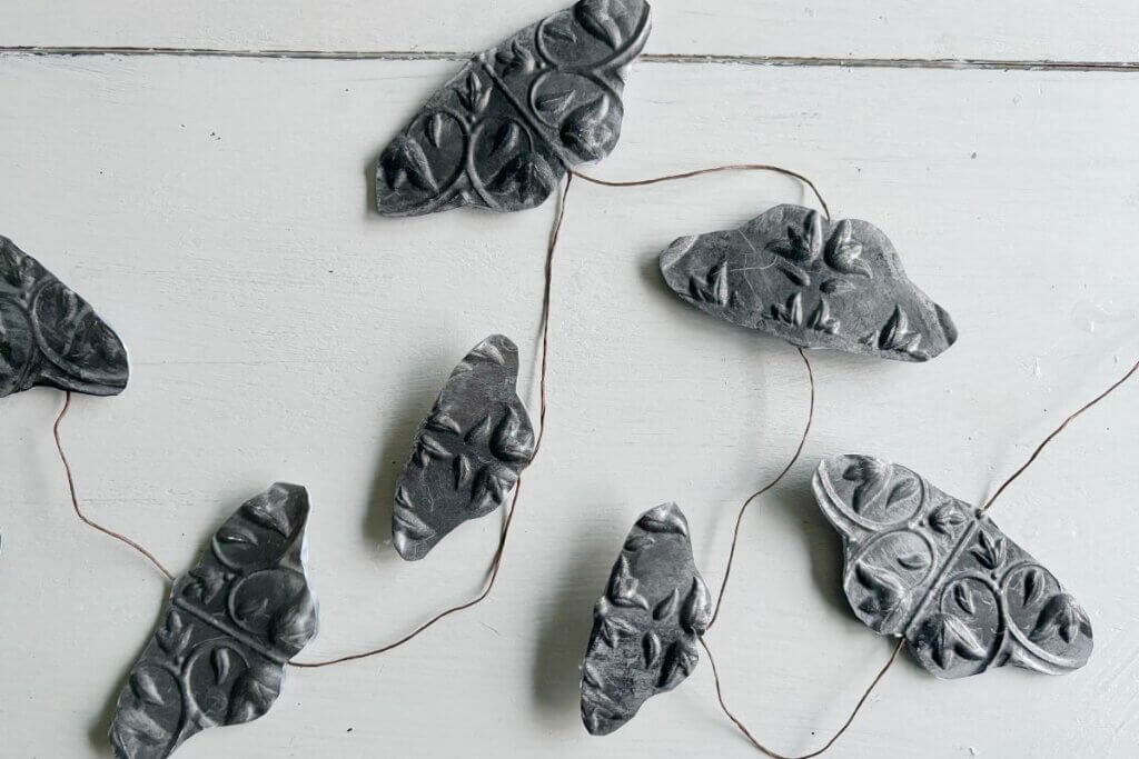 Faux metal moth garland DIY for Halloween.