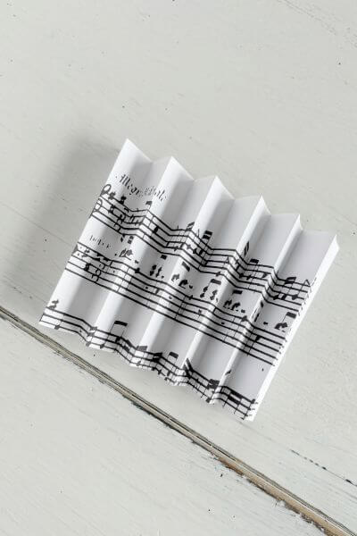 Finished music notes paper folded accordion style. 