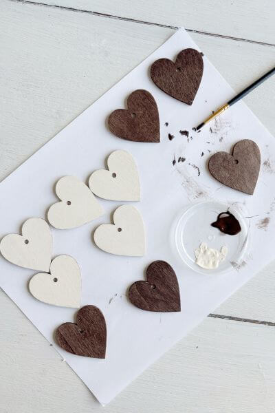 Wood hearts painted white and brown. 