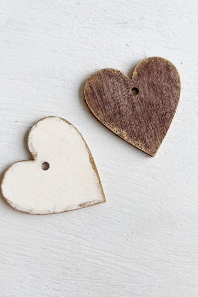 One white and one brown heart with Rub n' Buff around the edges. 