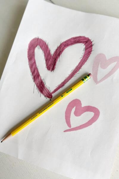 Place the printable shaded side down onto the canvas and then use a pencil to color in each of the hearts.