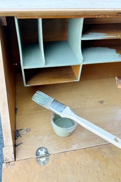 Paint the cubbies on the inside of the desk. 
