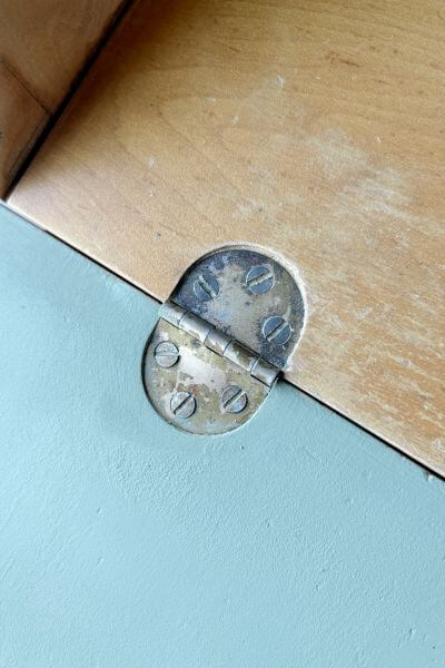 Hinge on inside of the desk. 