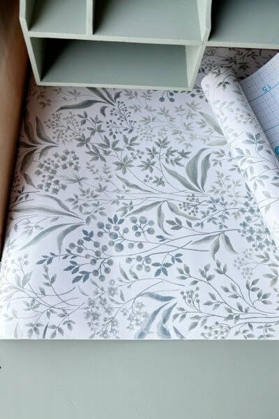 Apply contact paper to the inside portion of the desk. 