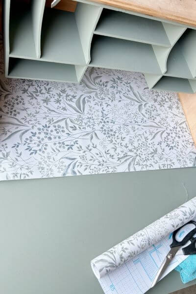 Contact paper measured from left to right and cut with scissors.