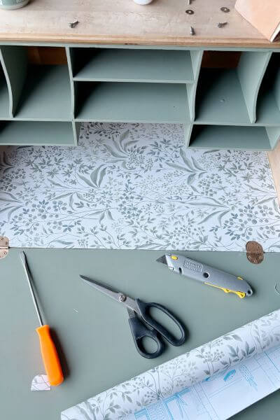 Finish applying contact paper to the inside portion of the desk. 