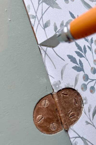 Trim any excess contact paper with small exacto knife. 