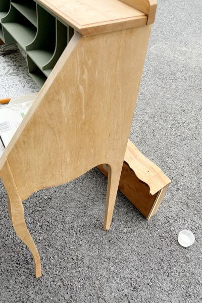 Placing topcoat on the desk.
