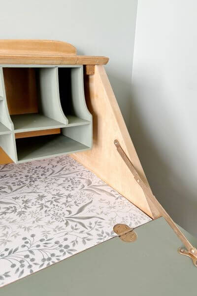 Pic of the inside of the secretary desk which was painted and had contact paper applied. 