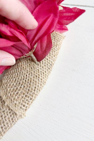 Tuck the stem into the burlap. 