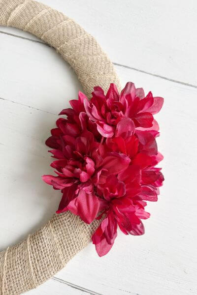 First bunch of dahlia flowers tucked into the burlap. 