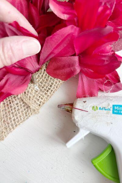 Hot glue the stems to the burlap. 