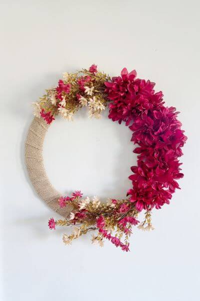 Finished fall wreath DIY hanging on a wall. 