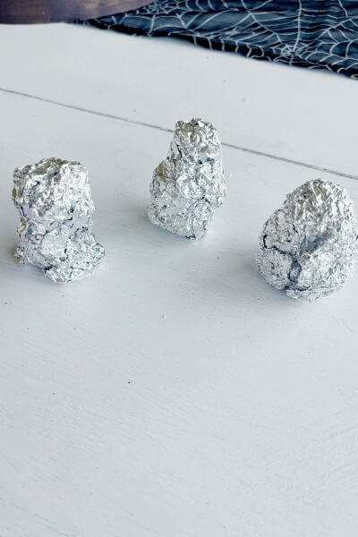 Three tin foil forms to drape clay over. 