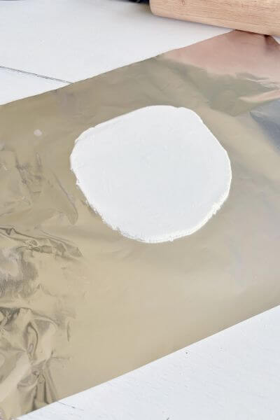 Air dry clay rolled flat to about a 1/4-inch thickness. 