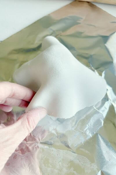 Gently pinch and form the clay making waves that look like a ghost's sheet.