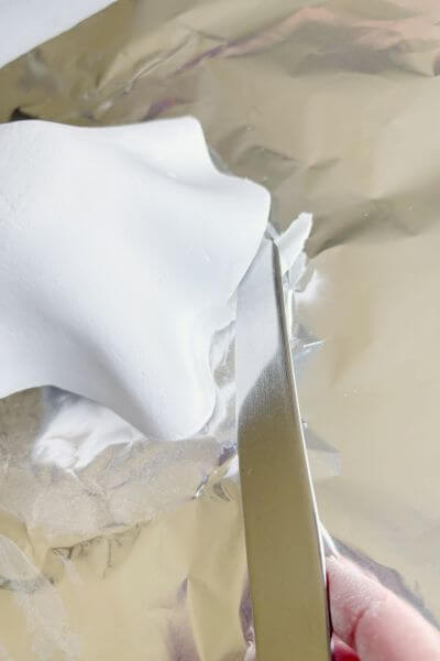 Trim the folds as needed with a butter knife. 